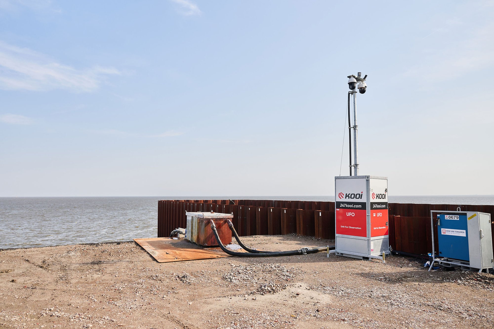 Kooi surveillance system monitoring a waterfront construction site with sheet piling, ensuring safety and security in a coastal environment.